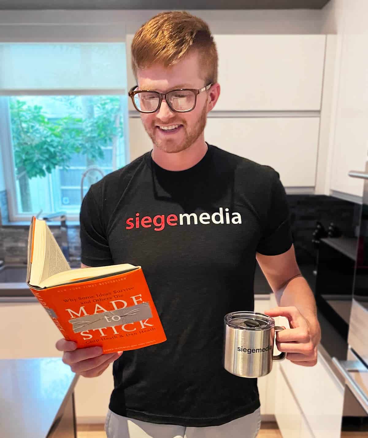 A happy Sieger enjoying free Siege Media swag.
