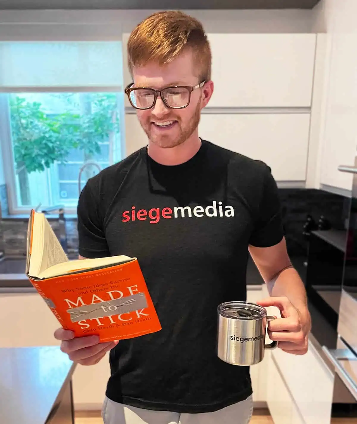 A happy Sieger enjoying free Siege Media swag.