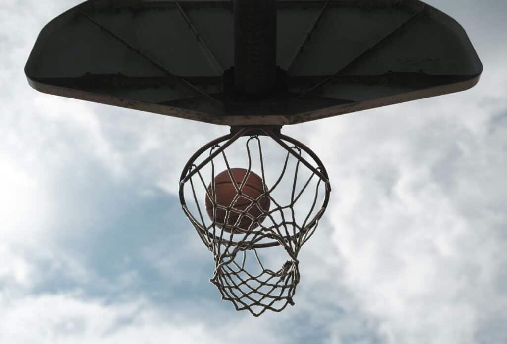 photo of a basketball going into a hoop