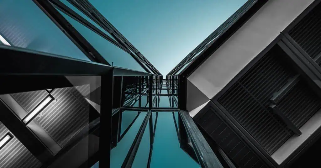 An abstract view of buildings from below.